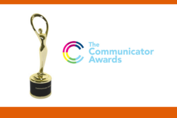 Logo for The Communicator Awards next to a gold statue trophy