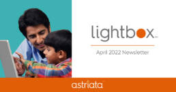 Thumbnail for April 2022 Lightbox Newsletter featuring a father and son using a touchscreen laptop